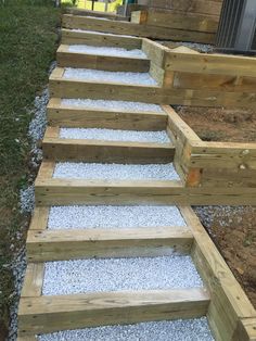 some steps made out of wood and gravel