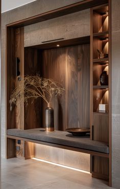 a wooden shelf with some vases on it