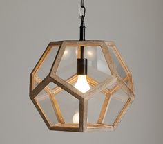 a wooden light fixture hanging from a ceiling