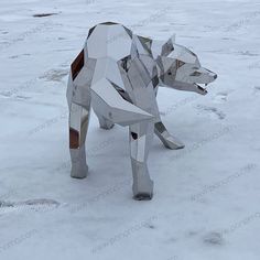 a sculpture of a dog made out of silver foil in the middle of some snow