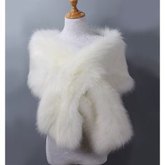 a white fur stole on a mannequin