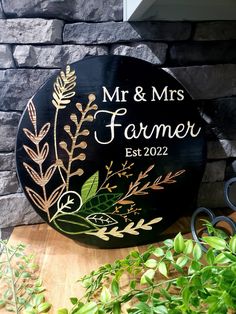 a wooden sign that says mr and mrs farmer on it