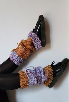 the legs of a woman wearing knitted socks