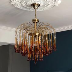 a chandelier hanging from the ceiling in a room