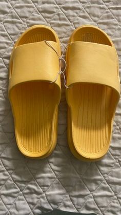 Yellow Color Slippers for all use time at home or Garden or Beach.  Ideal for the women because it hugs warmly and caressing the leg Amazing for men because they feel a very comfortable light walk around the house or in their garden at their BBQ Parties These slippers are made of durable and EVA, one-piece molding technology process ensures its durability and good resilience, foam slides will not collapse long-term wear. water proofing sole absorbs noise when walking on the ground, ideal for daily walks. These slippers are easy to clean and quick-drying, non-slip wear-resistant sole that is flexible, keep your feet dry and health, stay away from sweaty feet.  These Slippers with a casual style is quite suitable for outdoor and indoor home. Perfect for All Season, Into all spaces of your ho Foam Slides, Beach Yellow, Bbq Parties, Water Proofing, Soft Sole Slippers, Daily Walk, Walk On, Yellow Color, Womens Slippers