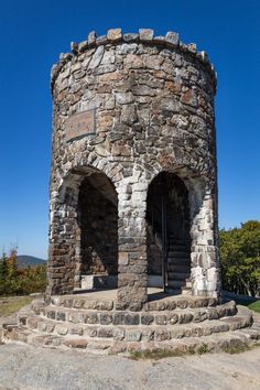 an old stone tower with steps leading to it