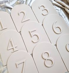 the numbers are laid out and ready to be put into placemats or coasters