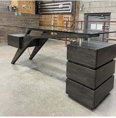 an office desk with three drawers in front of it