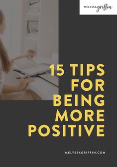 a woman sitting at a desk with the title 15 tips for being more positive