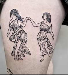 two women holding hands on the back of a woman's thigh, both in black ink