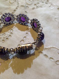 This amethyst and Iolite bracelet is very lively and bright. The stones are deep colors and well matched. The sterling silver is plated with rhodium to protect the bracelet from tarnish and give the appearance of white gold. 7.5 inches All jewelry is shipped in a nice gift box. Check out our over a THOUSAND great reviews Engraving is $4 per letter and is not always perfect depending on the piece. It can take a few days if the jeweler is busy. This is payable to Paypal Judithsltd@gmail.com Purple Jewelry With Natural Stones In Metal, Purple Metal Jewelry With Natural Stones, Purple Jewelry With Natural Stones, Elegant Round Purple Crystal Bracelet, Elegant Purple Round Crystal Bracelet, Purple Gemstone Metal Jewelry, Purple Spiritual Bracelet Jewelry, Spiritual Purple Bracelet Jewelry, Unique Purple Sterling Silver Bracelets