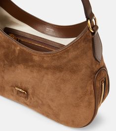 Find TOM FORD Tara Suede Shoulder Bag on Editorialist. The Tom Ford Tara shoulder bag is crafted from suede and features a top handle and an adjustable shoulder strap. The bag has a flap closure with a turn lock, and the sides can be adjusted with zippers. The interior features a zipped pocket. It is made in Italy. Purse Outfit, 90s Y2k Fashion, Suede Purse, Bags Aesthetic, Leather Hobo Bag, Cute Bags, Leather Hobo, Black Tote Bag, Leather Tote Bag