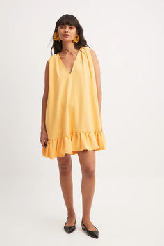 Frill Detail Sleeveless Mini Dress V-neck Ruffle Hem Sundress, Summer Sleeveless V-neck Dress With Ruffles, V-neck Ruffled Sundress Mini Dress, Yellow V-neck Dress With Ruffle Hem, Ruffled Mini V-neck Dress For Vacation, Vacation Sleeveless Mini Dress With Ruffle Hem, Vacation Mini Sleeveless Dress With Ruffle Hem, Sleeveless Mini Sundress With Ruffle Hem, Sundress With Ruffle Hem In Mini Length