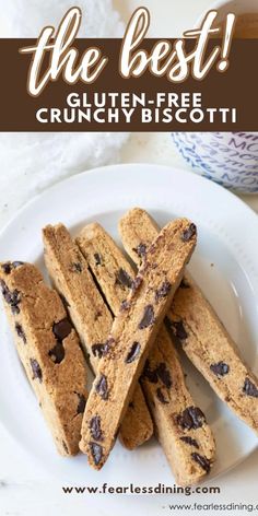 gluten - free biscotti on a plate next to a cup of coffee