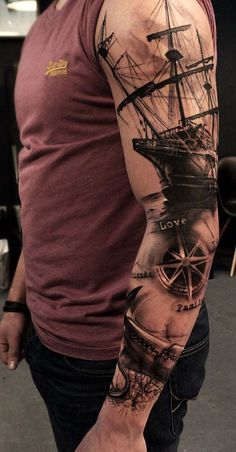 a man with a ship tattoo on his arm