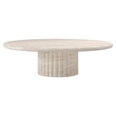 a white marble table with an oval base