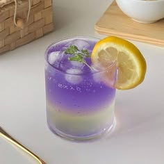 a purple and yellow drink sitting on top of a table