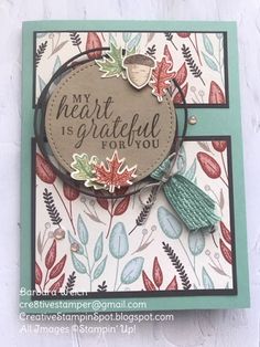 a close up of a card on a white background with leaves and words that say, my heart is grateful