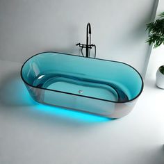 a glass bathtub with blue lights on the bottom and sides, in front of a white wall