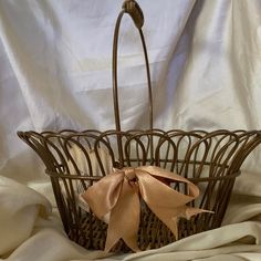 a brown basket with a bow on it