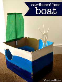 a cardboard boat is sitting on the floor