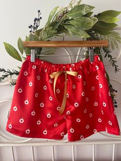 Delicate  and trendy Christmas satin pyjamas shorts made of  quality satin with cute Christmas baubles and little harts on red background.  This can be a beautiful photo prop or lounge wear. Also I can make matching Mother and daughter shorts per request or matching bridesmaids shorts for weddings around festive Season  Featuring an elasticized waist for comfort and easy dressing with a ribbon bow tie accent at front. These pj shorts has no side seams making more comfortable for sleeping.  Each of my items is handmade in small quantities with quality fabrics and attention to detail to ensure a professional finish. All seams are overlock stitched  Sizing:  made to order. Please message me in conversation what size you need or you can send the hips measurements and the desired length. Red Satin Bottoms For Summer, Red Satin Summer Bottoms, Cute Short Sleepwear For Pajama Party, Cute Short Length Sleepwear For Pajama Party, Cute Pajama Shorts For Pajama Party, Cute Pajama Party Shorts, Red Pajama Shorts For Bedtime, Satin Summer Shorts, Cute Bedtime Shorts