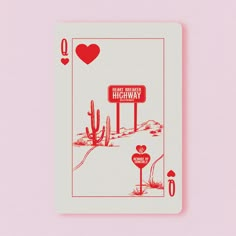 a playing card with an image of a highway sign in the background and hearts on it