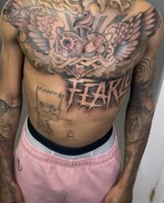 a man with lots of tattoos on his chest