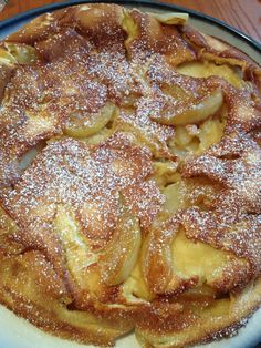 an apple pie with powdered sugar on top