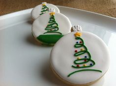 two decorated cookies sitting on top of a white plate next to an email message that reads flickr