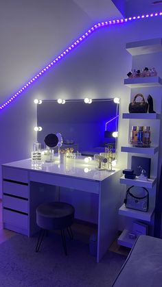 a white desk topped with a mirror and lights