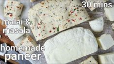 some cheeses are laying on a table and ready to be cut into small pieces