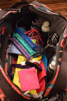 the inside of a duffel bag filled with items