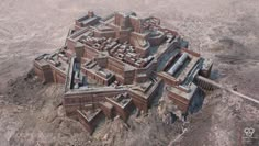 an aerial view of a castle in the middle of some desert land with no people around it