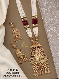 Description :- Gold-Plated Indian Jewelry Set, Long Necklace and Earrings, Temple Haram South Indian Jewellery Long Haram Choker Necklace Sets Gift yourself a royal look with this perfectly crafted kundan necklace set from Manalisstudio. Crafted with high quality kundan stones and pearls, it is impressive in design. The green enamel artwork adds perfect texture to the design. Perfect for weddings and festivities, this antique necklace set should be put on with your favorite sari or lehenga. 100% Antique Necklace Set, Indian Jewelry Set, Long Haram, Kundan Necklace Set, Indian Jewelry Sets, South Indian Jewellery, Necklace Sets, Choker Necklace Set, Kundan Necklaces