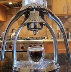 an espresso machine sitting on top of a kitchen counter