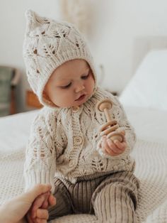 Such a beautiful bonnet in lace knit with a gorgeous leaf pattern. Finished with wood button closure for the strap. Match this with our Leaf Lace Sweater to complete the look. What a wonderful gift for a little person. • 100% Acrylic• Cold handwash• Hand knit Pretty Sweater, Lace Bonnet, Pretty Sweaters, Up Costumes, Wood Buttons, Baby Bonnet, Knit Cardigan Sweater, Lace Sweater, Lace Cardigan