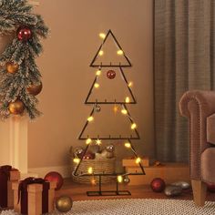 a christmas tree with lights in the shape of a triangle