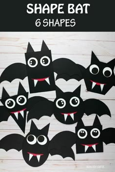 paper bats with eyes and mouths cut out to look like bats