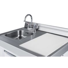 a stainless steel kitchen sink with faucet and soap dispenser