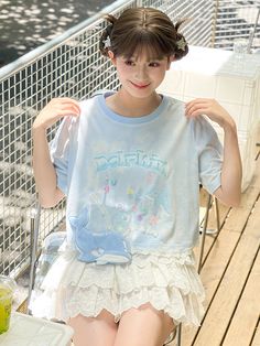 Make a splash with this enchanting blue tie-dyed T-shirt, adorned with adorable dolphins, whimsical hearts, and charming butterflies. Perfect for those who love to blend kawaii aesthetics with a touch of marine magic. The soft, breathable fabric ensures all-day comfort, while the intricate designs make it a standout piece in any wardrobe. Whether you're heading to a casual outing or just lounging at home, this T-shirt is your go-to for effortless cute style. Garment Size SizeSMLFull Length4546.5 Blue Kawaii Tops For Summer, Blue Kawaii Top For Summer, Kawaii Blue Tops For Summer, Blue Kawaii Summer Tops, Playful Tie Dye Short Sleeve T-shirt, Playful Tie-dye Short Sleeve T-shirt, Cute Tie-dye Crew Neck Top, Cute Tie Dye Crew Neck Top, Blue Kawaii Short Sleeve Tops