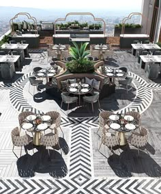 an outdoor dining area with tables, chairs and potted plant on the roof terrace