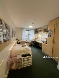 a bedroom with green carpeting and white walls