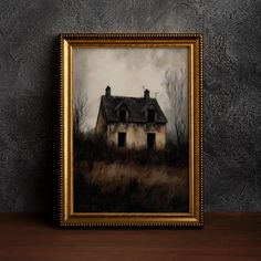 an old house in the middle of a field with no leaves on it, framed against a gray wall