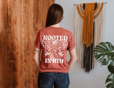 Are you looking for a unique and stylish christian Tshirt? Look no further than rooted in him Tee! This shirt is made out of 100% cotton and features a cool Jesus design on the back. It's perfect for wearing during warmer weather or as a gift for someone special. Order your rooted in him tshirt today and be sure to enjoy comfort and style at the same time! This classic unisex jersey short sleeve tee fits like a well-loved favorite. Soft cotton and quality print make users fall in love with it over and over again. These t-shirts have-ribbed knit collars to bolster shaping. The shoulders have taping for better fit over time. Dual side seams hold the garment's shape for longer.  .: 100% Airlume combed and ringspun cotton (fiber content may vary for different colors) .: Light fabric (4.2 oz/yd Rooted Christian Shirt, Cool Jesus, Jesus Design, Jesus Tees, Christian Tshirt, Bible Verse Shirt, Religious Shirt, Christian Tees, Christian Shirt