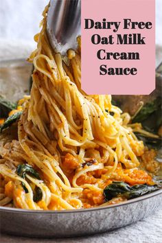 dairy - free oat milk cream sauce is being stirred with a ladle in a skillet