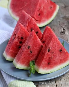 slices of watermelon on a blue plate