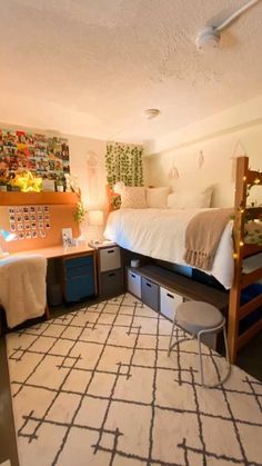 a bedroom with bunk beds and desks in it