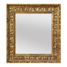 an ornate gold framed mirror on a white background