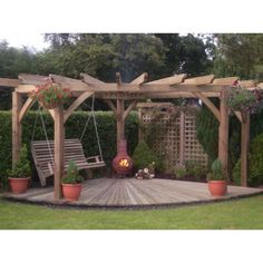 a wooden patio with swings and potted plants